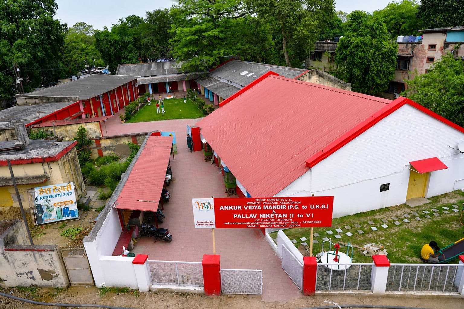 Aerial view of the full school campus with the WWA name board visible